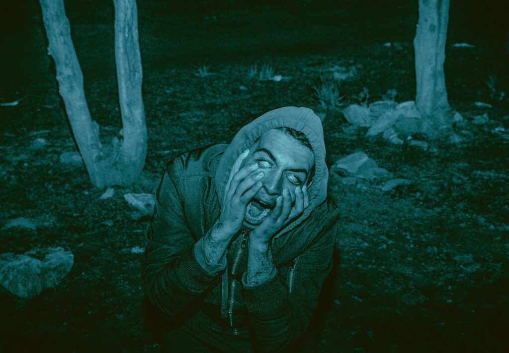 a man screaming in the woods to represent jump scares