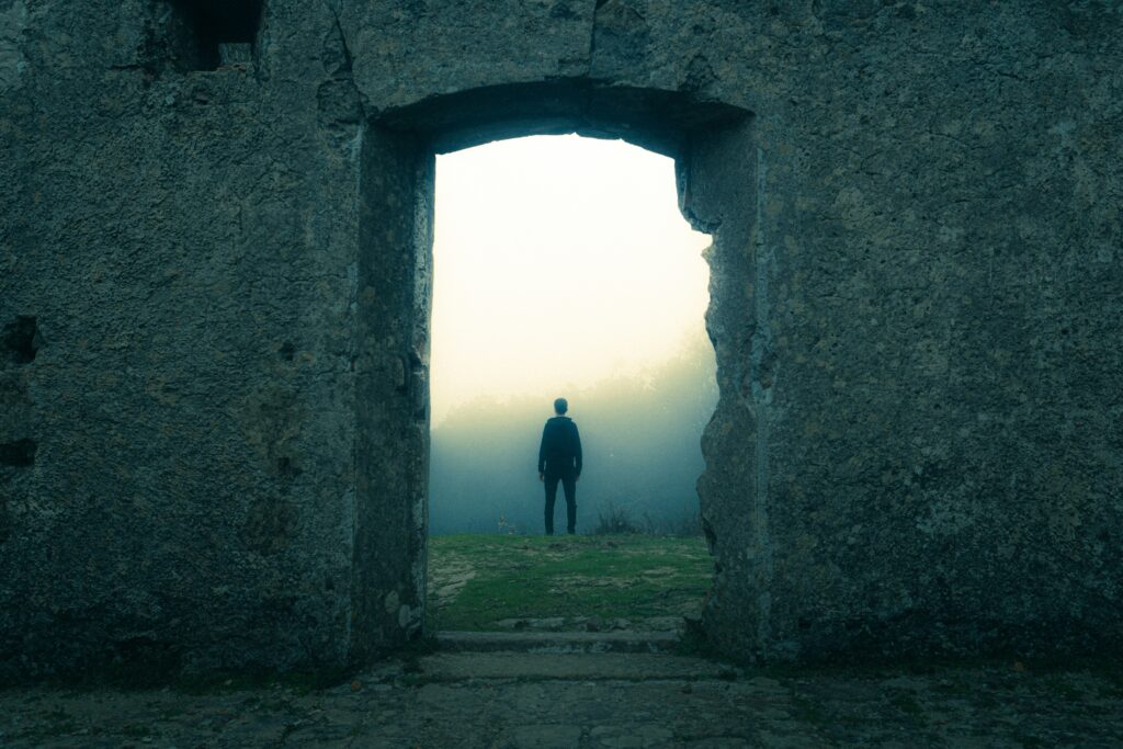 a dark figure in a cracked archway to represent the best horror short story endings