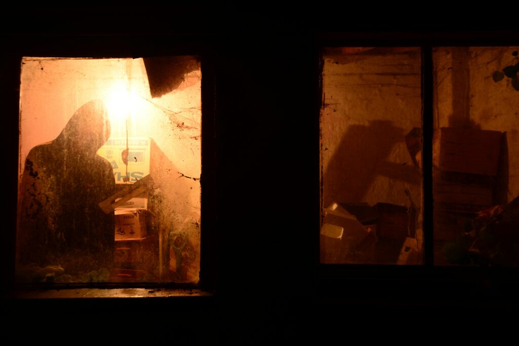 a spooky window to represent cozy horror writing prompts