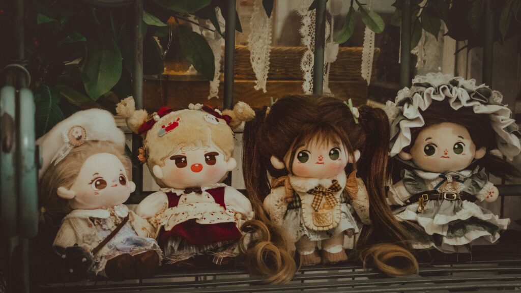cute but spooky dolls to represent how to write cozy horror