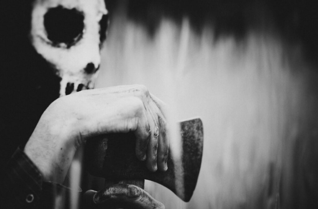 a masked killer to represent how to write slasher horror